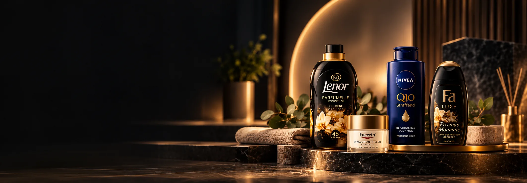Lenor, Nivea, Eucerin a Fa na mramorovém podstavci ve zlatém světle